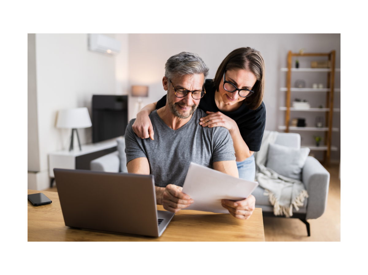 Couple comparing boiler options on a laptop at home